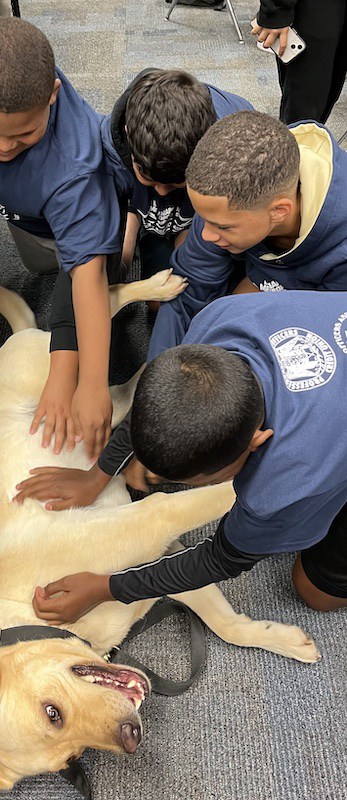 Hunter meets kids as part of a youth program.