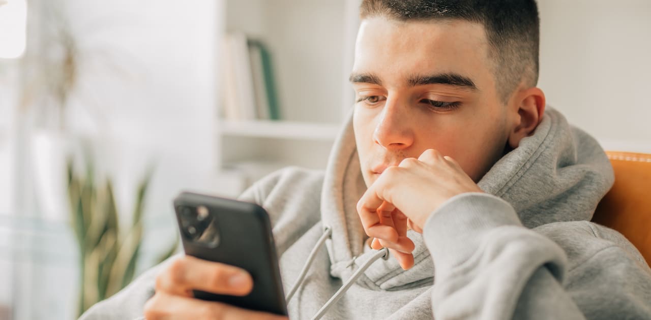 teen boy using phone